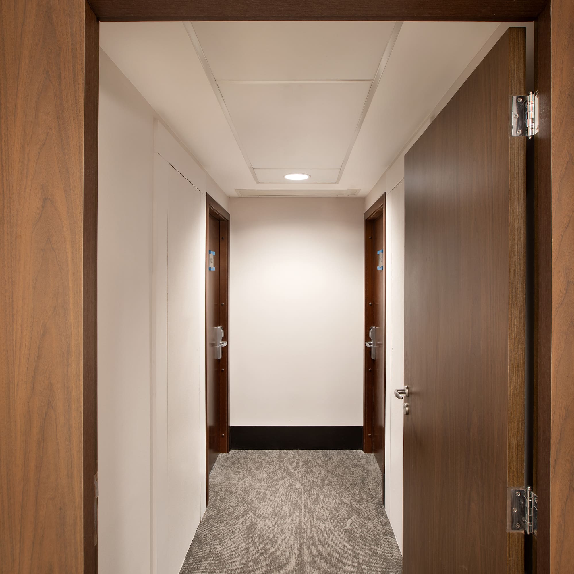 a hallway with two doors
