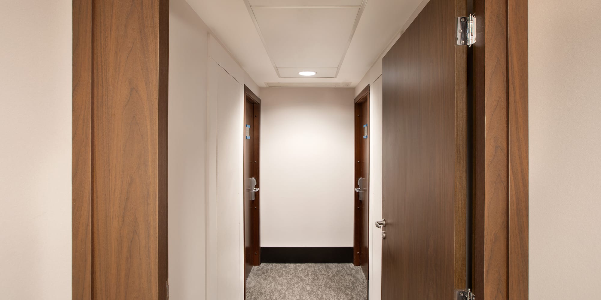 a hallway with two doors