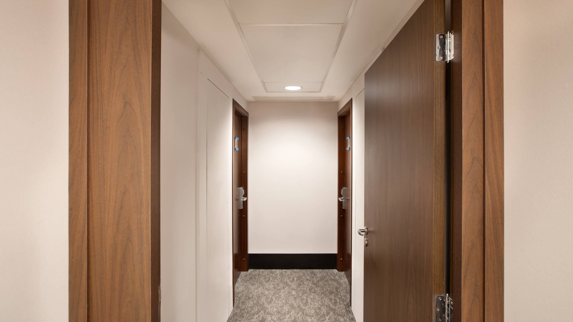 a hallway with two doors