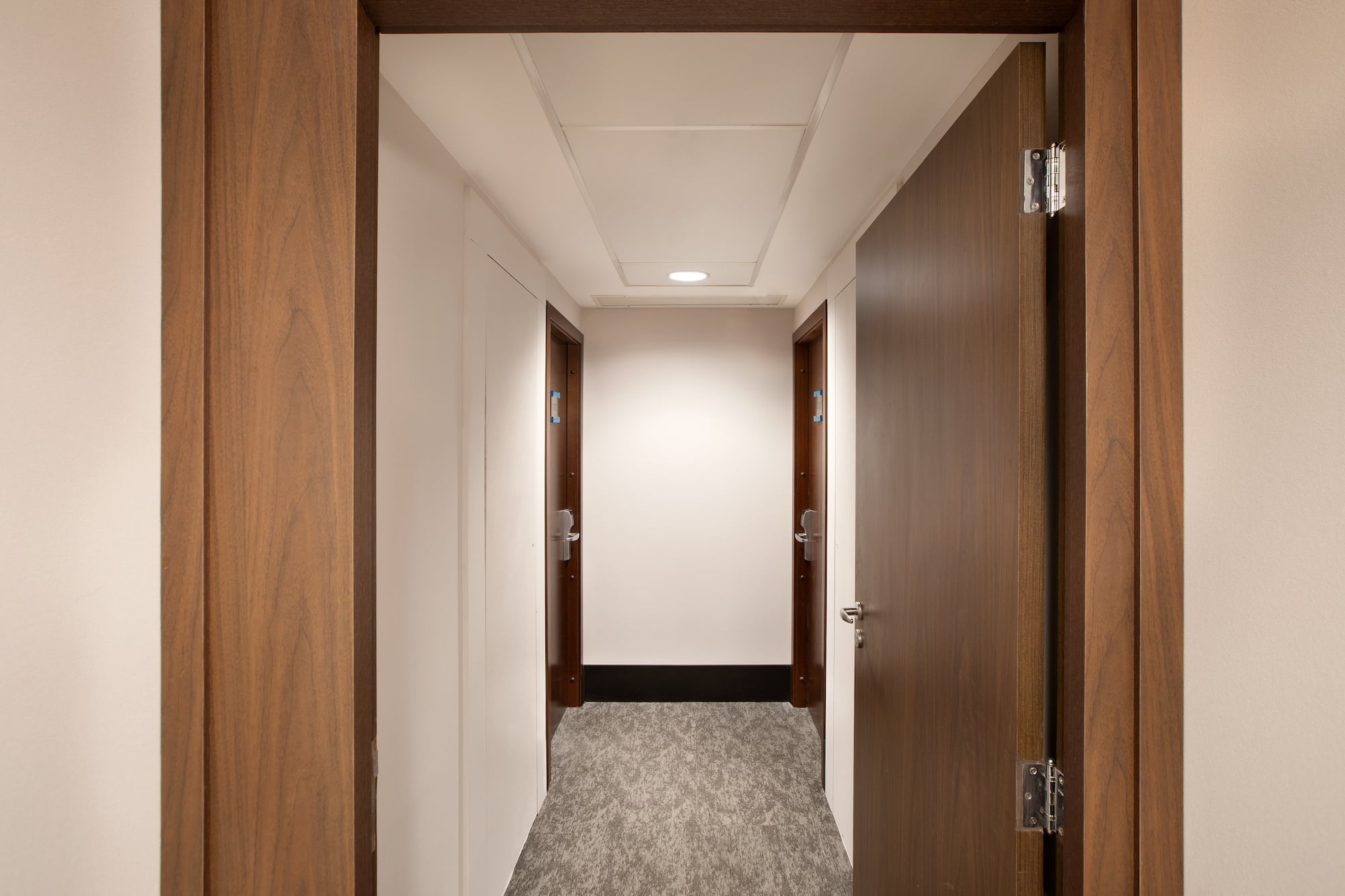 a hallway with two doors