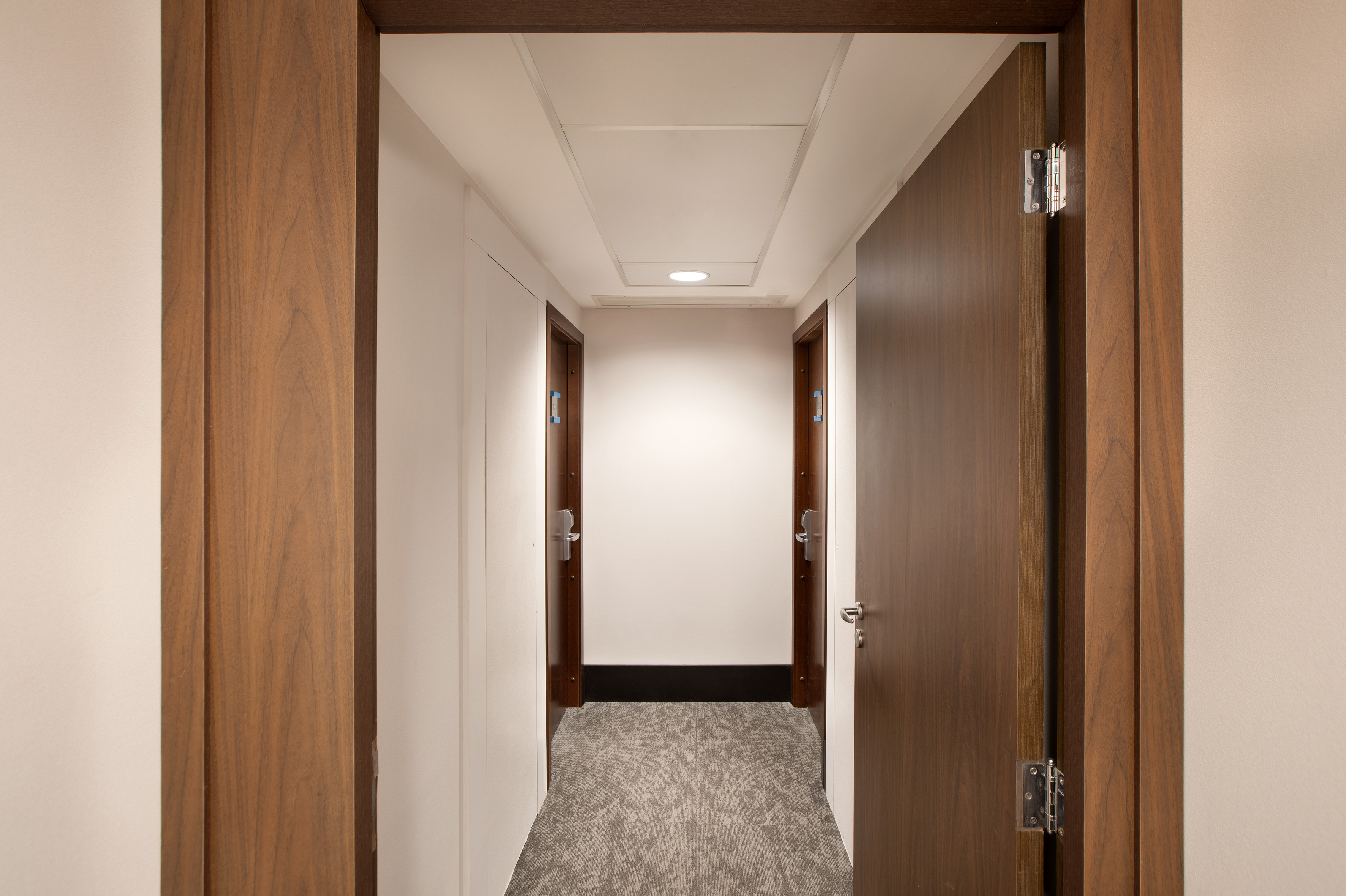 a hallway with two doors