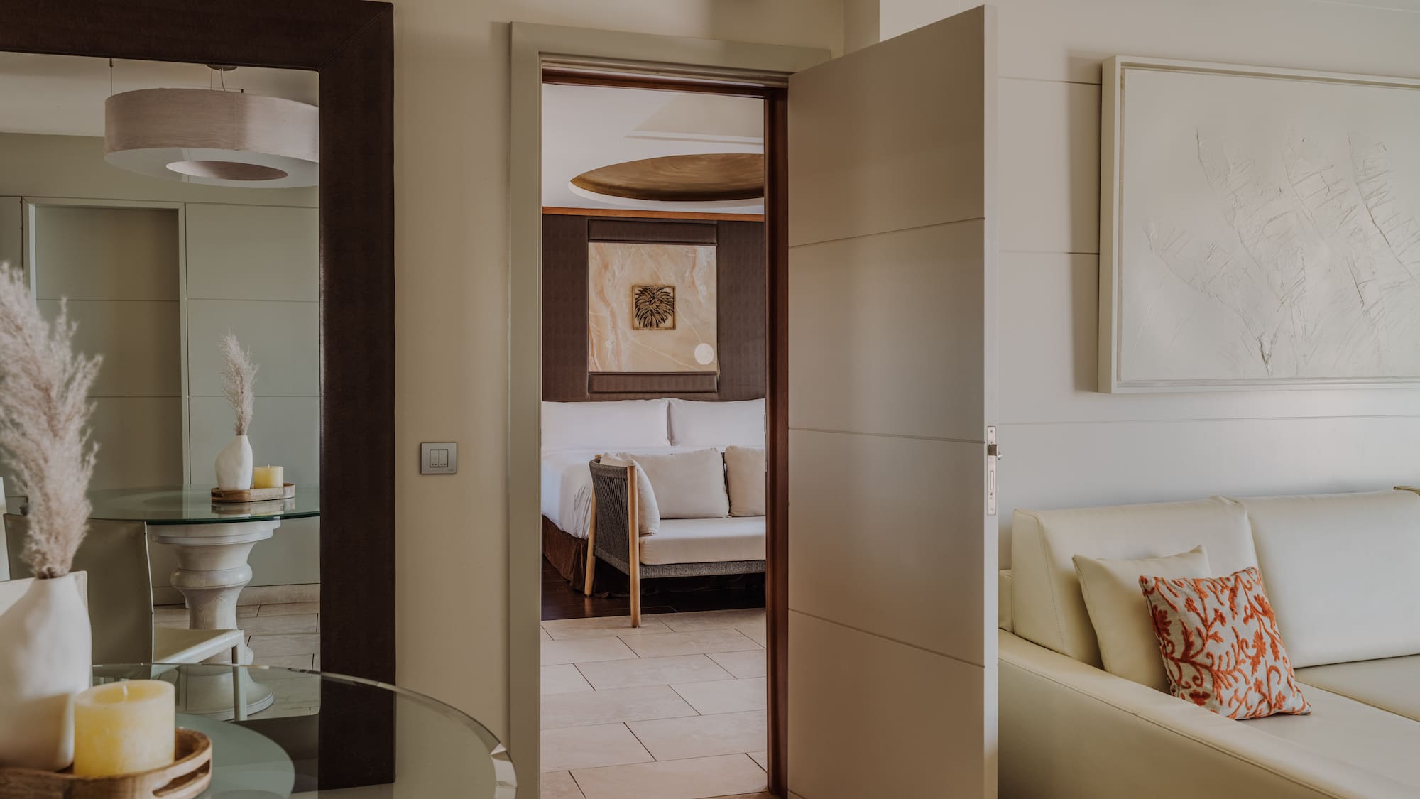 a room with a glass table and a couch