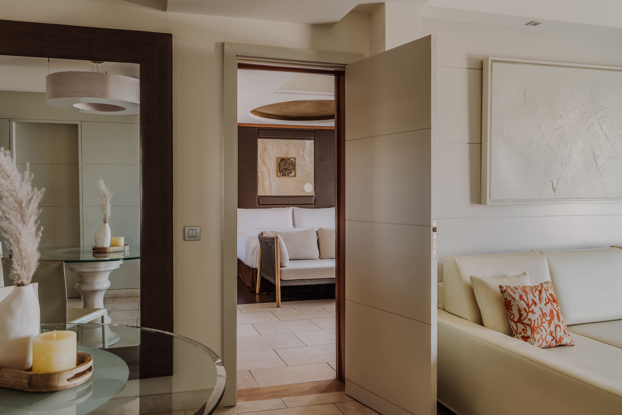 a room with a glass table and a couch