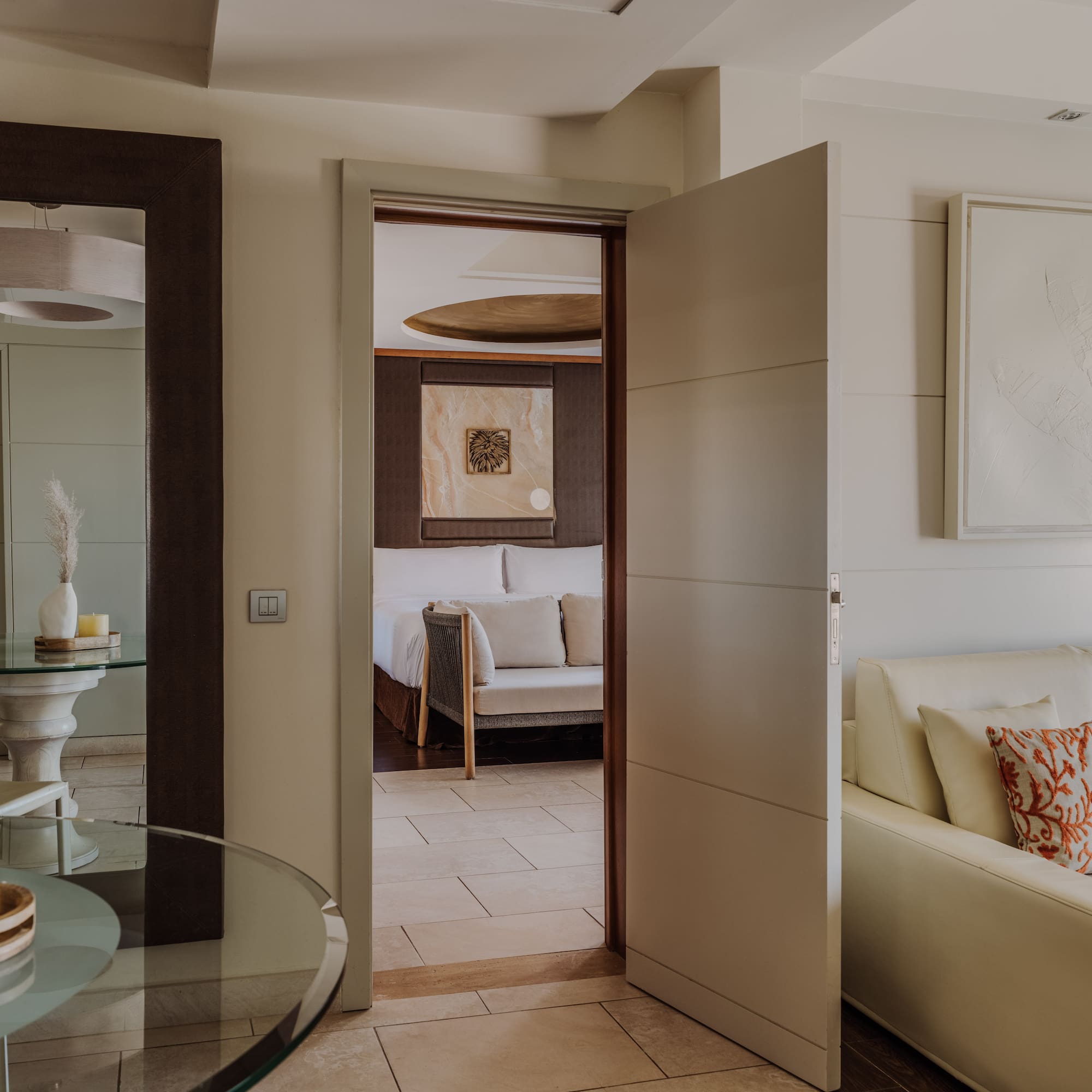 a room with a glass table and a couch