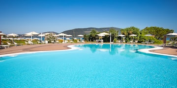 a pool with umbrellas and chairs