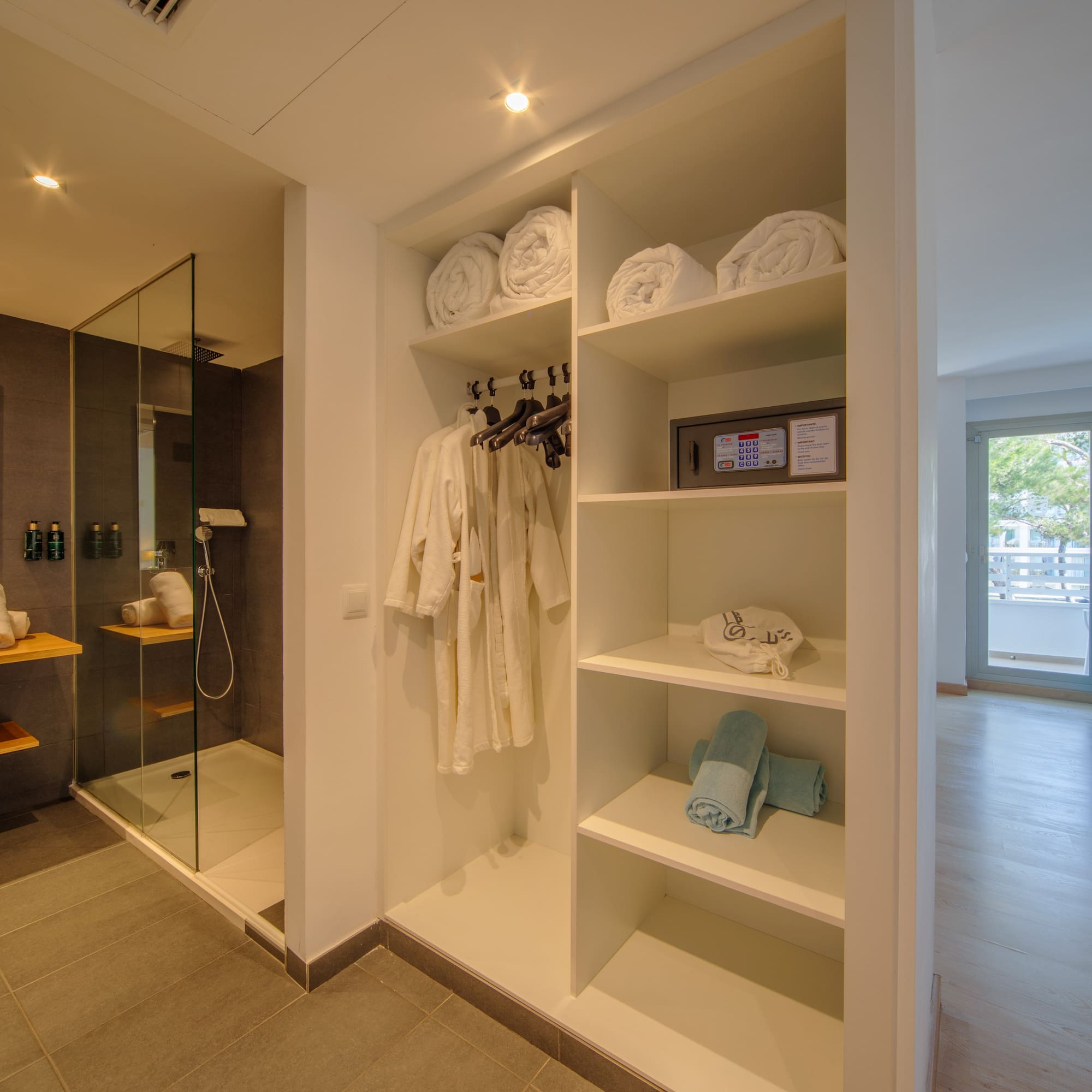 a bathroom with a shower and towels