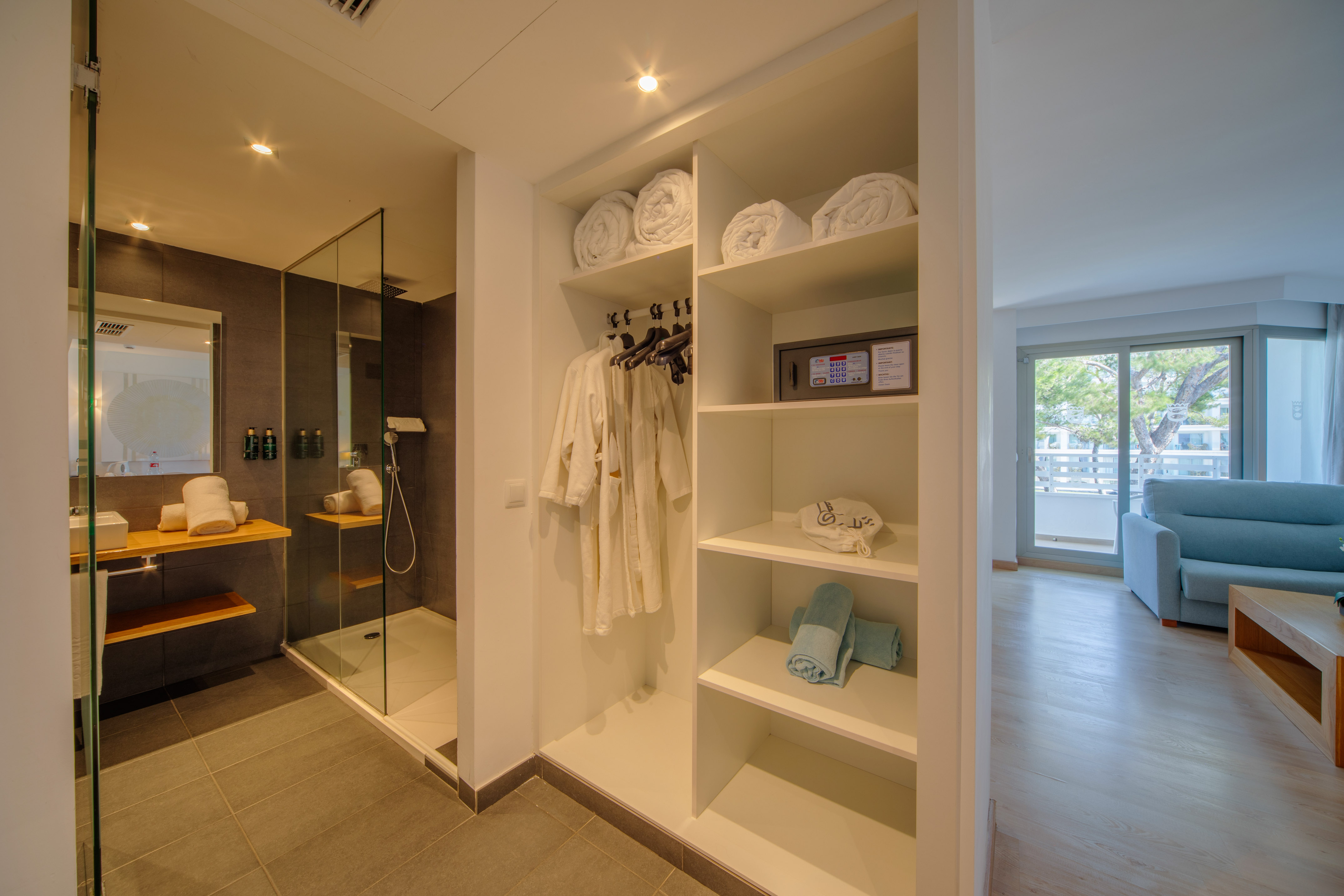 a bathroom with a shower and towels