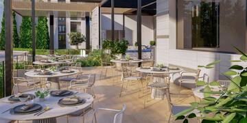 a patio with tables and chairs