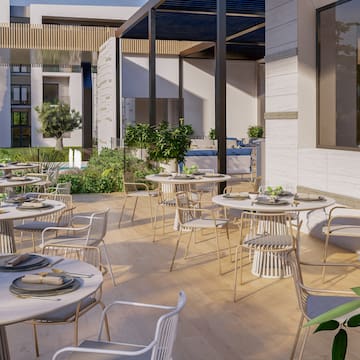 a patio with tables and chairs