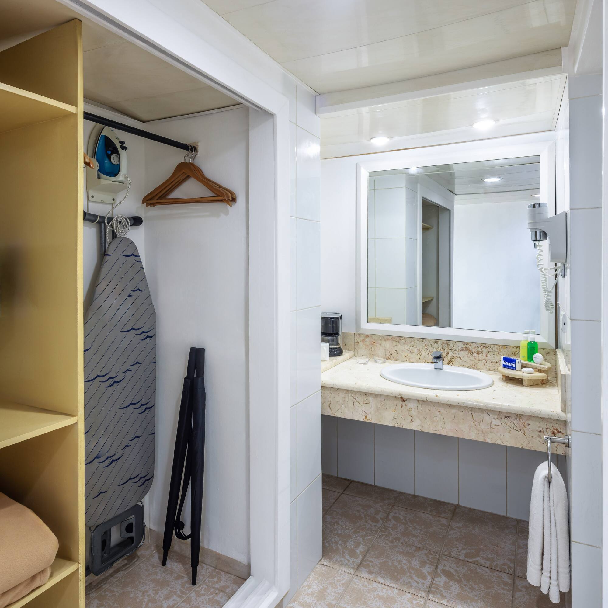 a bathroom with a sink and mirror