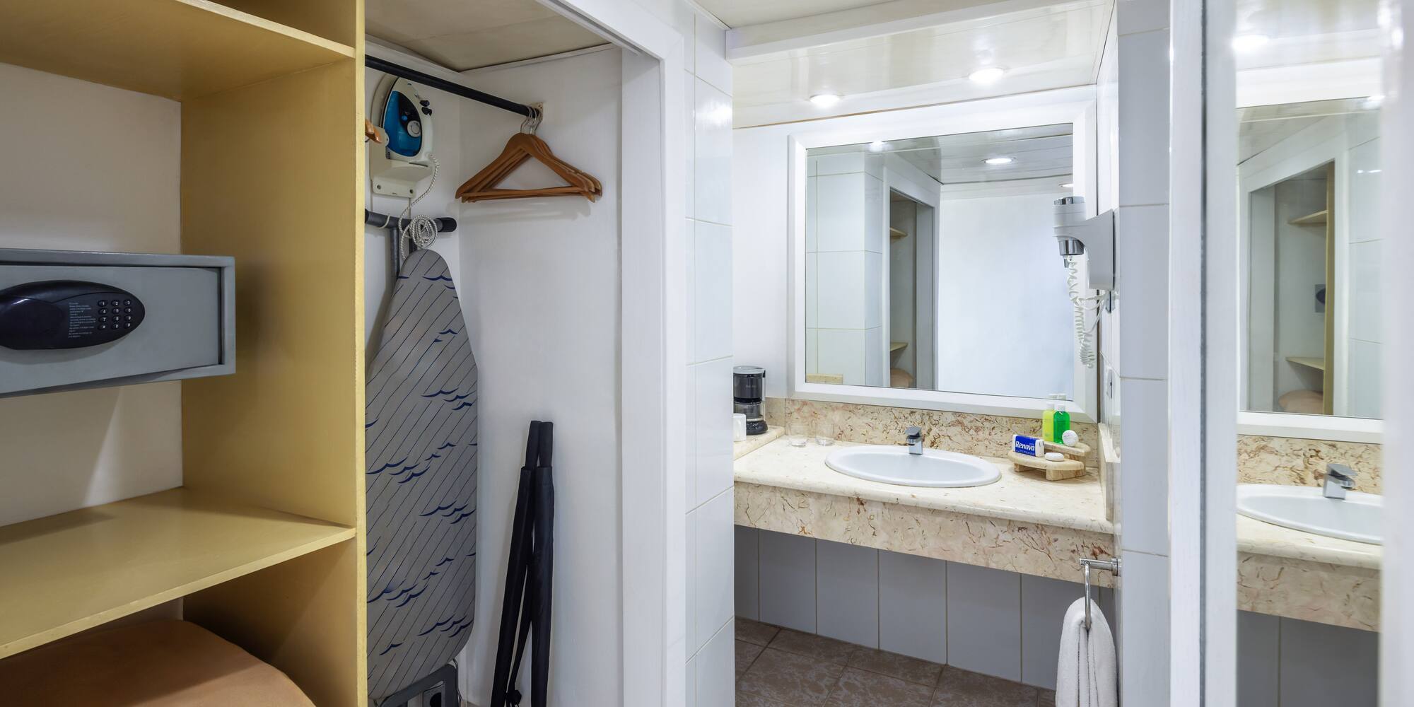a bathroom with a sink and mirror