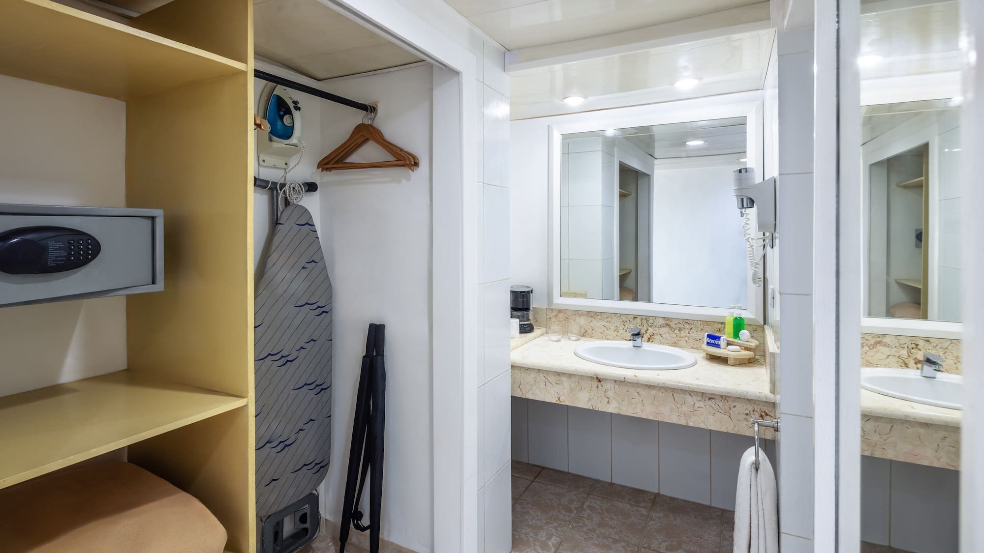 a bathroom with a sink and mirror