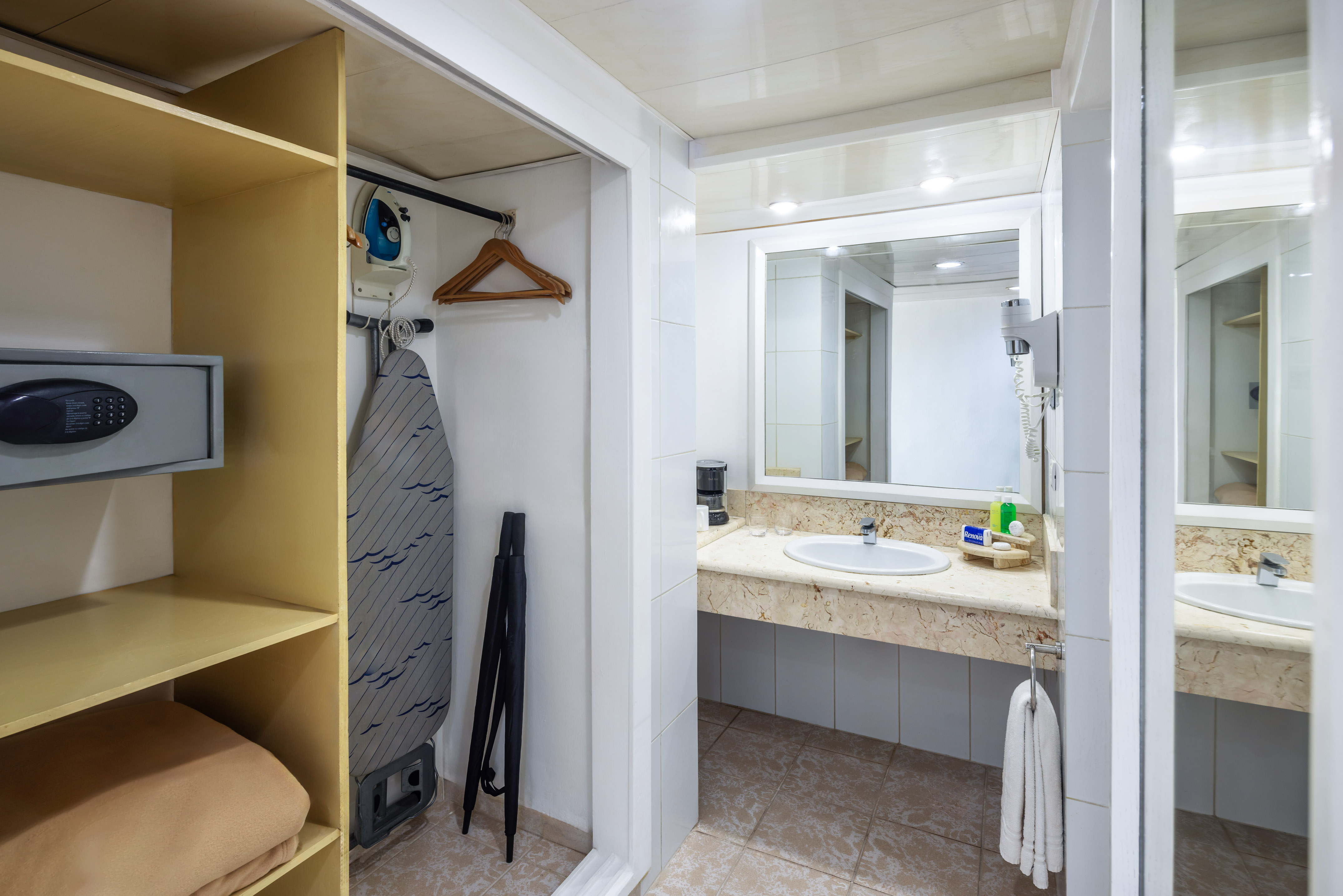 a bathroom with a sink and mirror