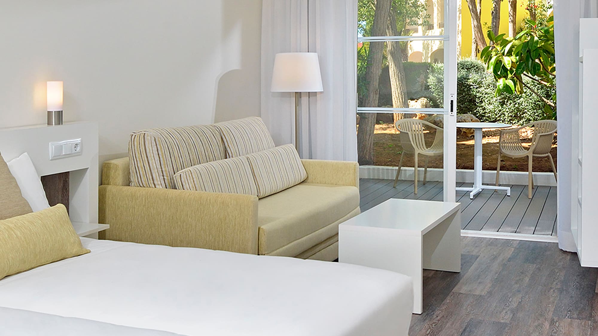 a room with two beds and a couch