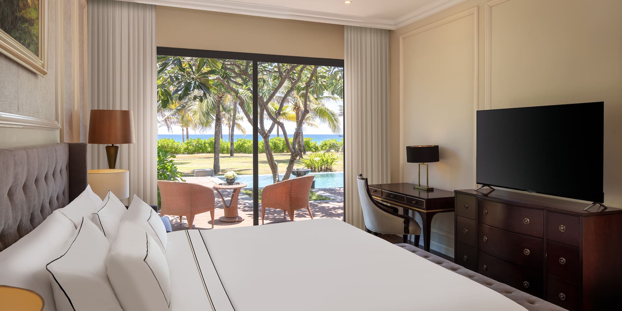 a room with a large bed and a television