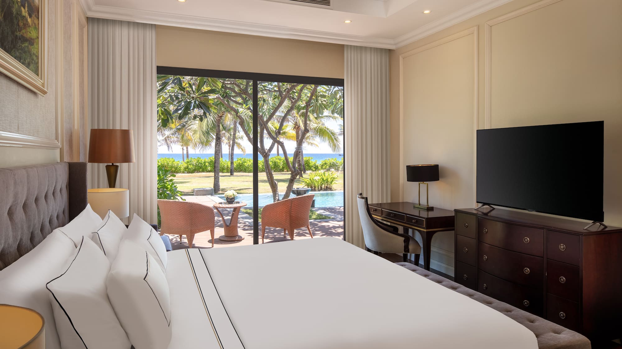 a room with a large bed and a television