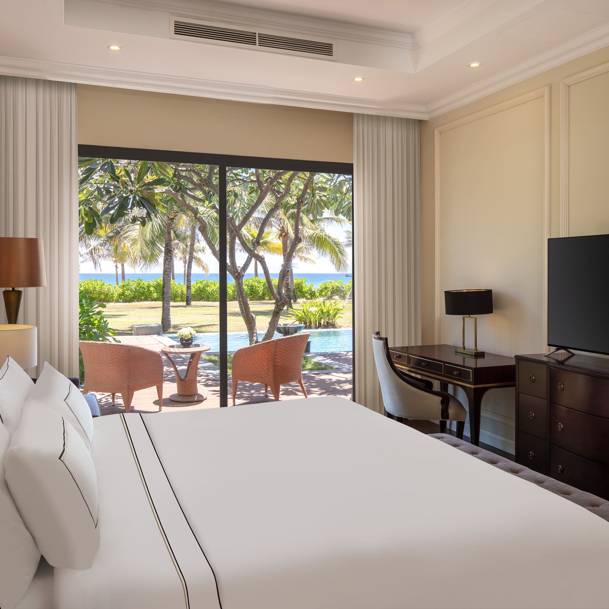 a room with a large bed and a television