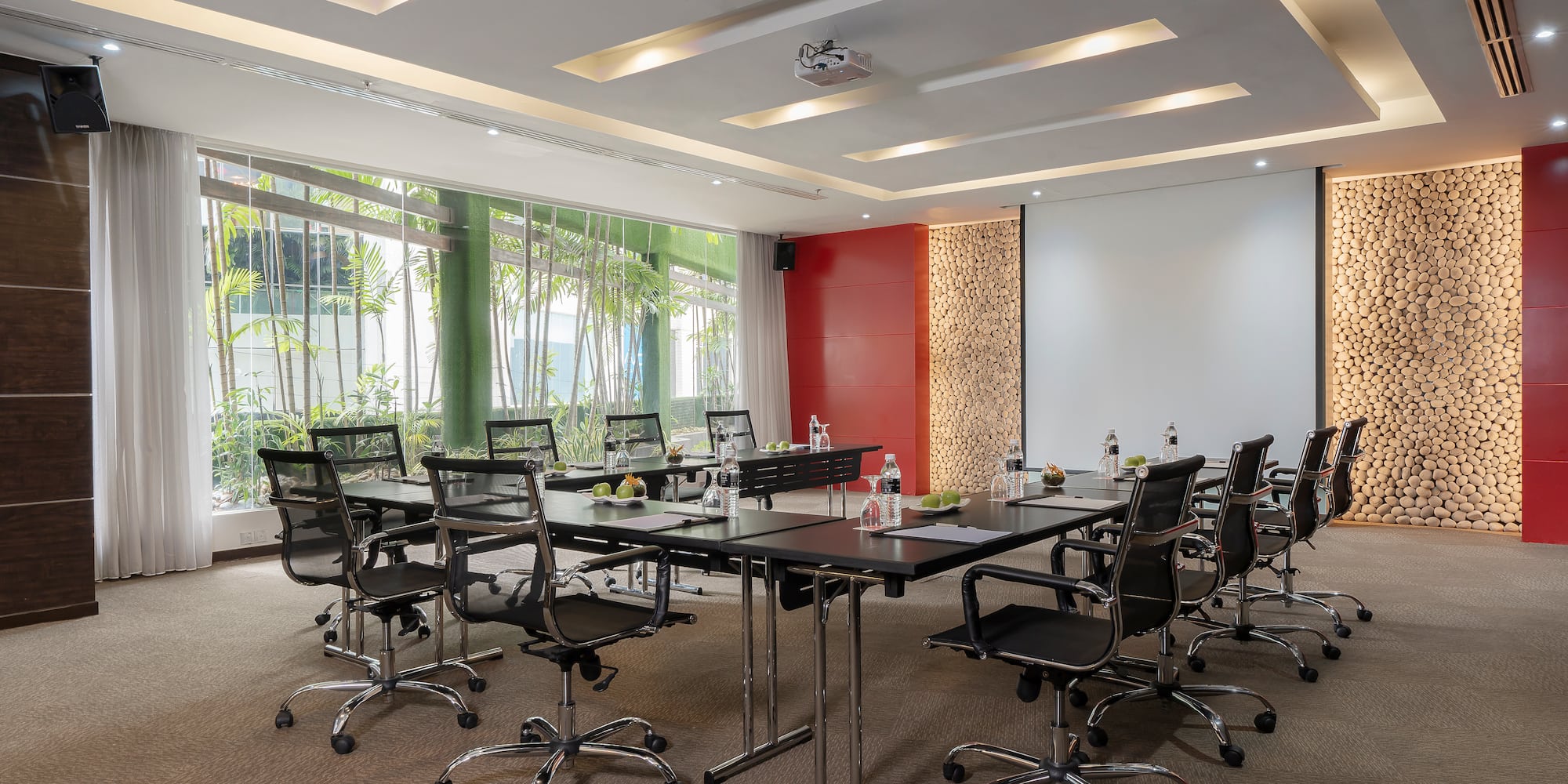 a conference room with a table and chairs