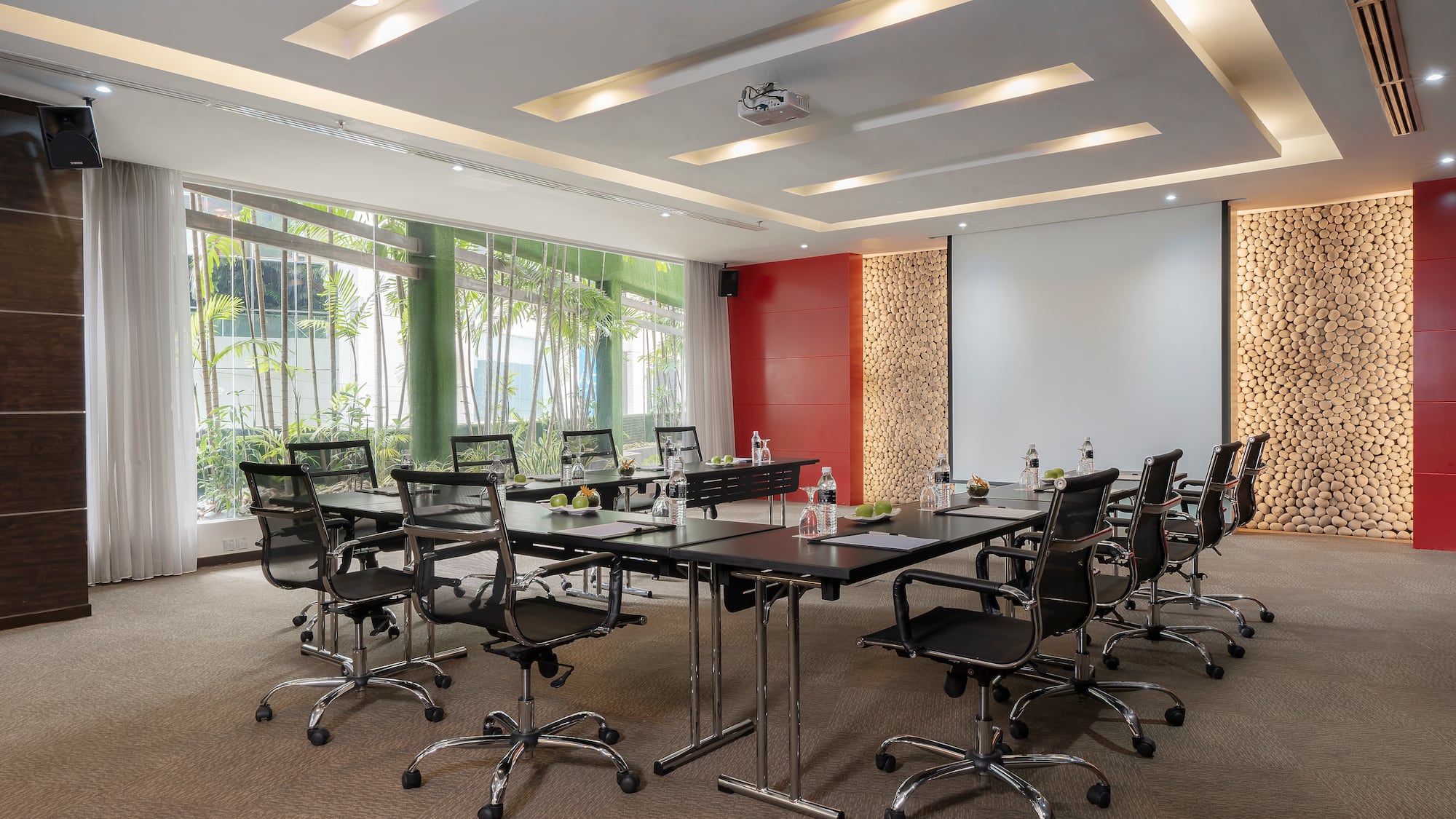 a conference room with a table and chairs