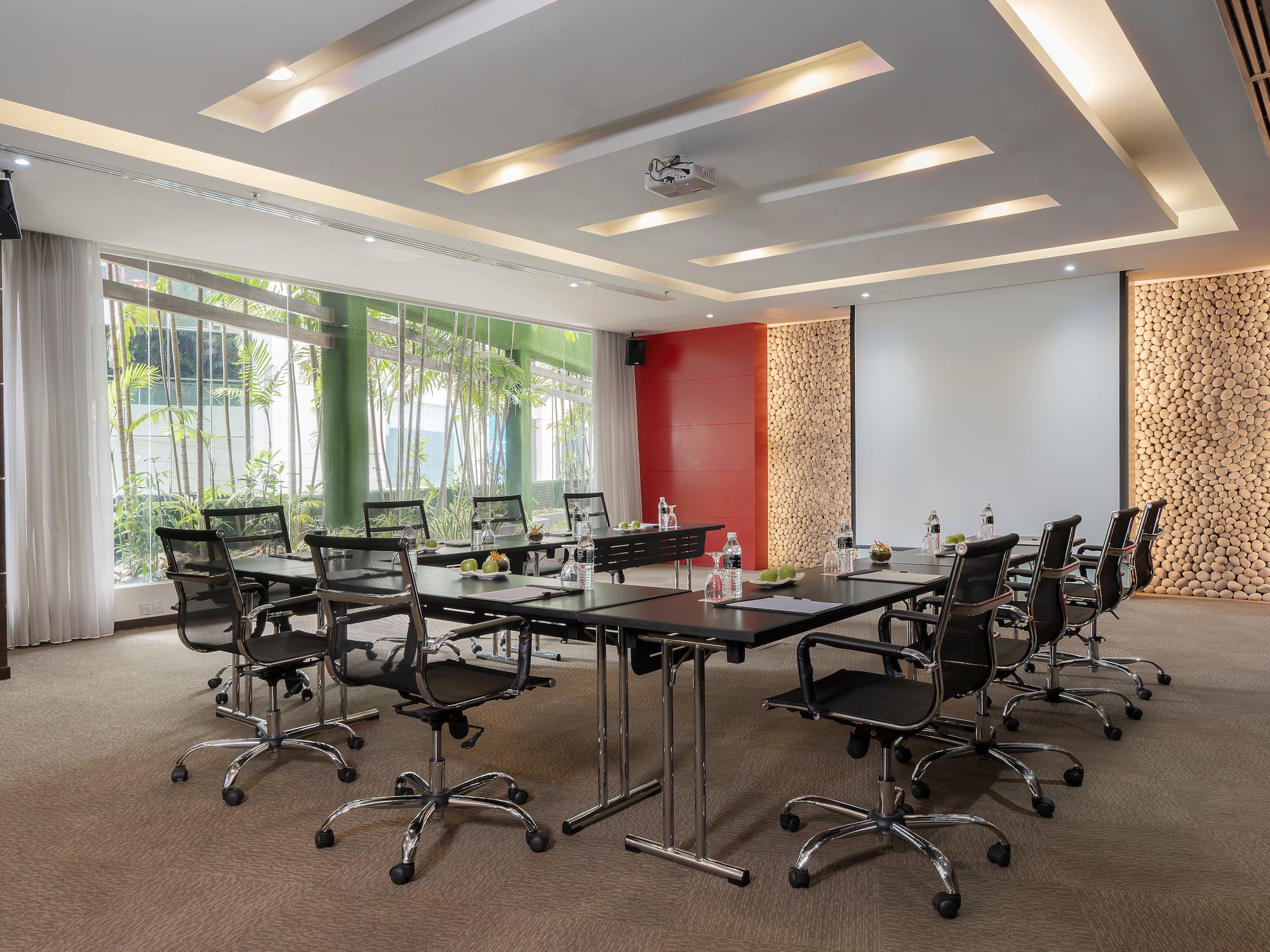 a conference room with a table and chairs