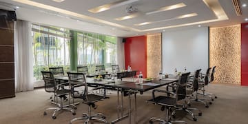 a conference room with a table and chairs