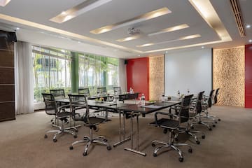 a conference room with a table and chairs