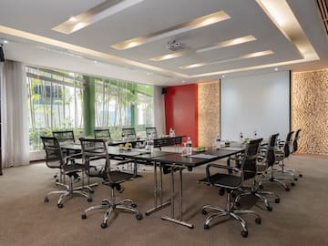 a conference room with a table and chairs