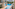 Luxury outdoor pool with gym view, modern villas, and shaded lounge chairs.