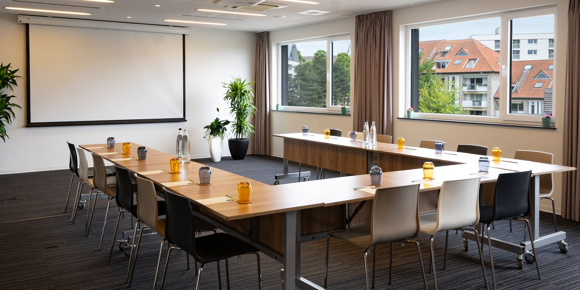 a room with a large table and chairs