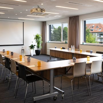 a room with a large table and chairs