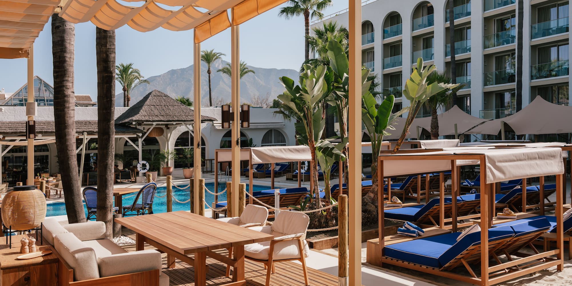 a pool with a table and chairs