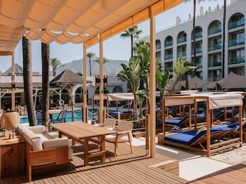 a pool with a table and chairs