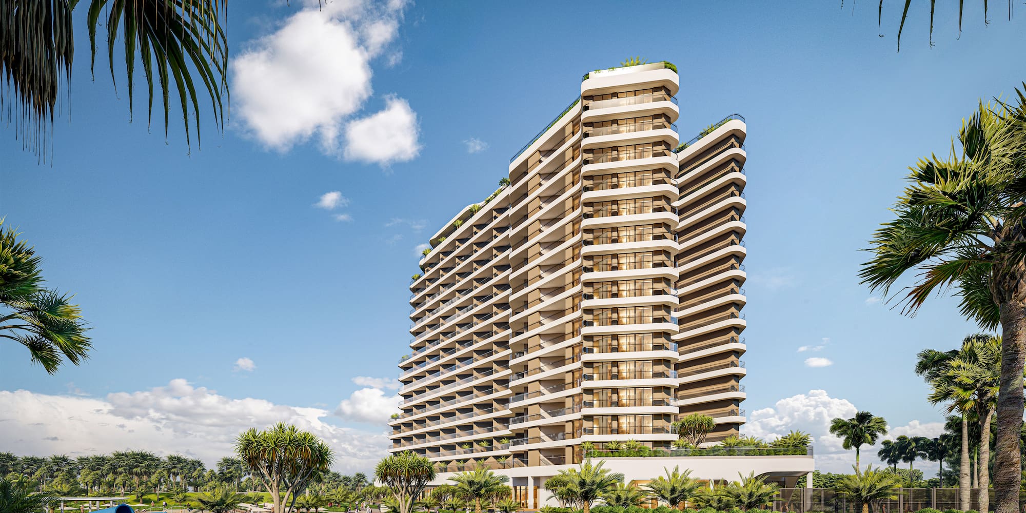 a tall building with trees and grass