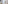 Hotel room with balcony, TV, white desk, and light wood floor.