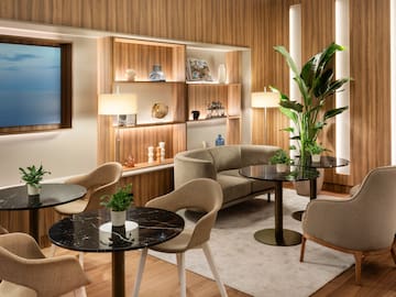 a room with a couch and tables