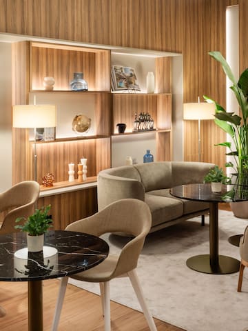 a room with a couch and tables