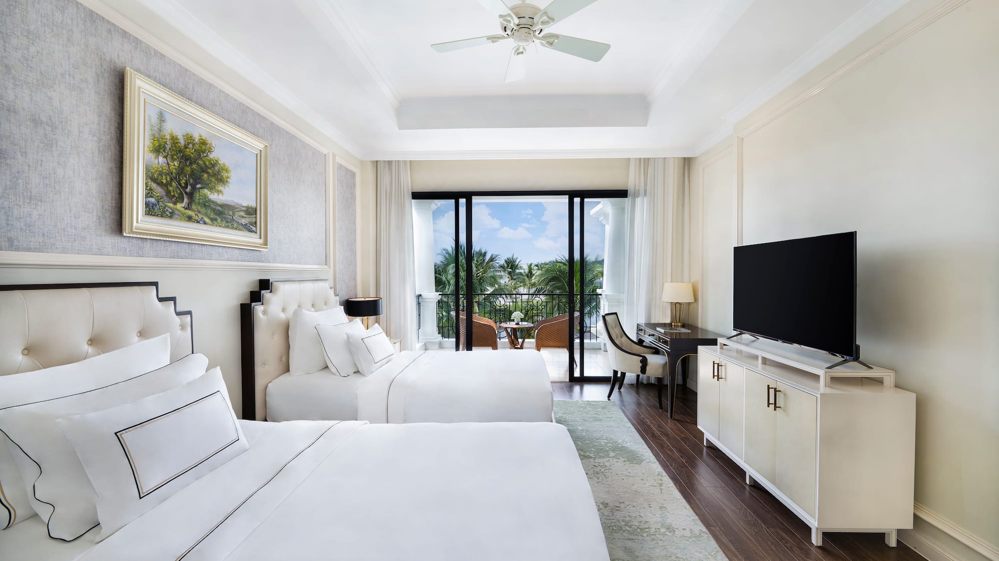 a room with two beds and a television