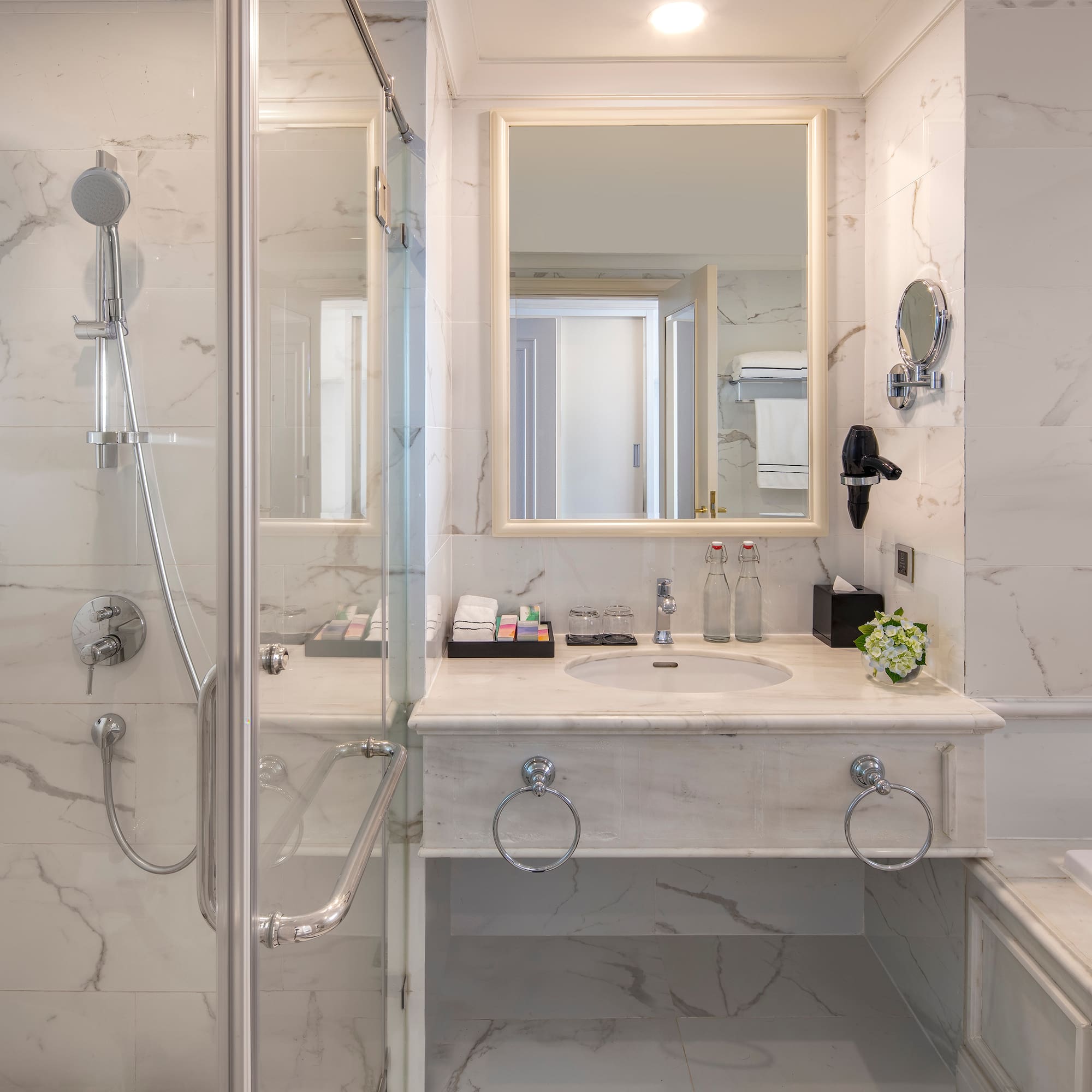 a bathroom with a shower and sink