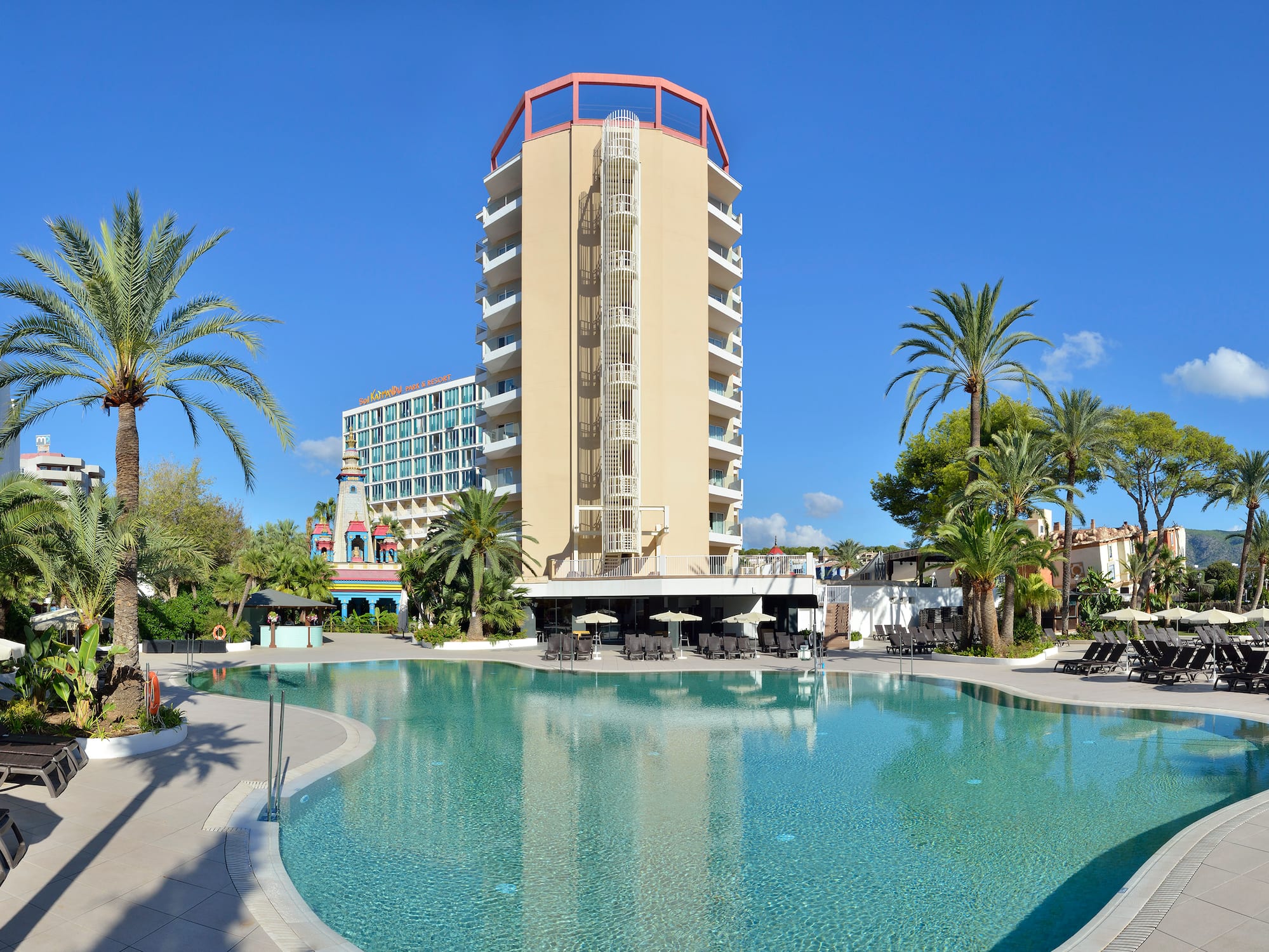 a pool with a building in the background