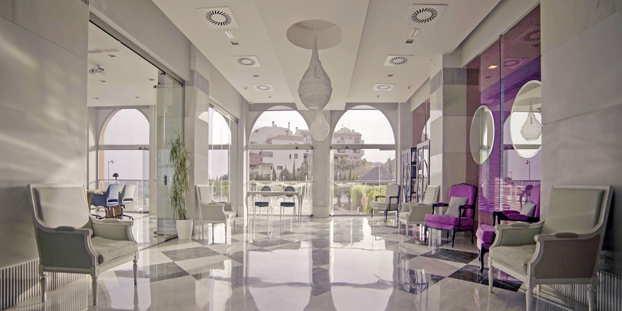 a room with chairs and a large window