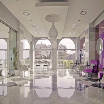 a room with chairs and a large window