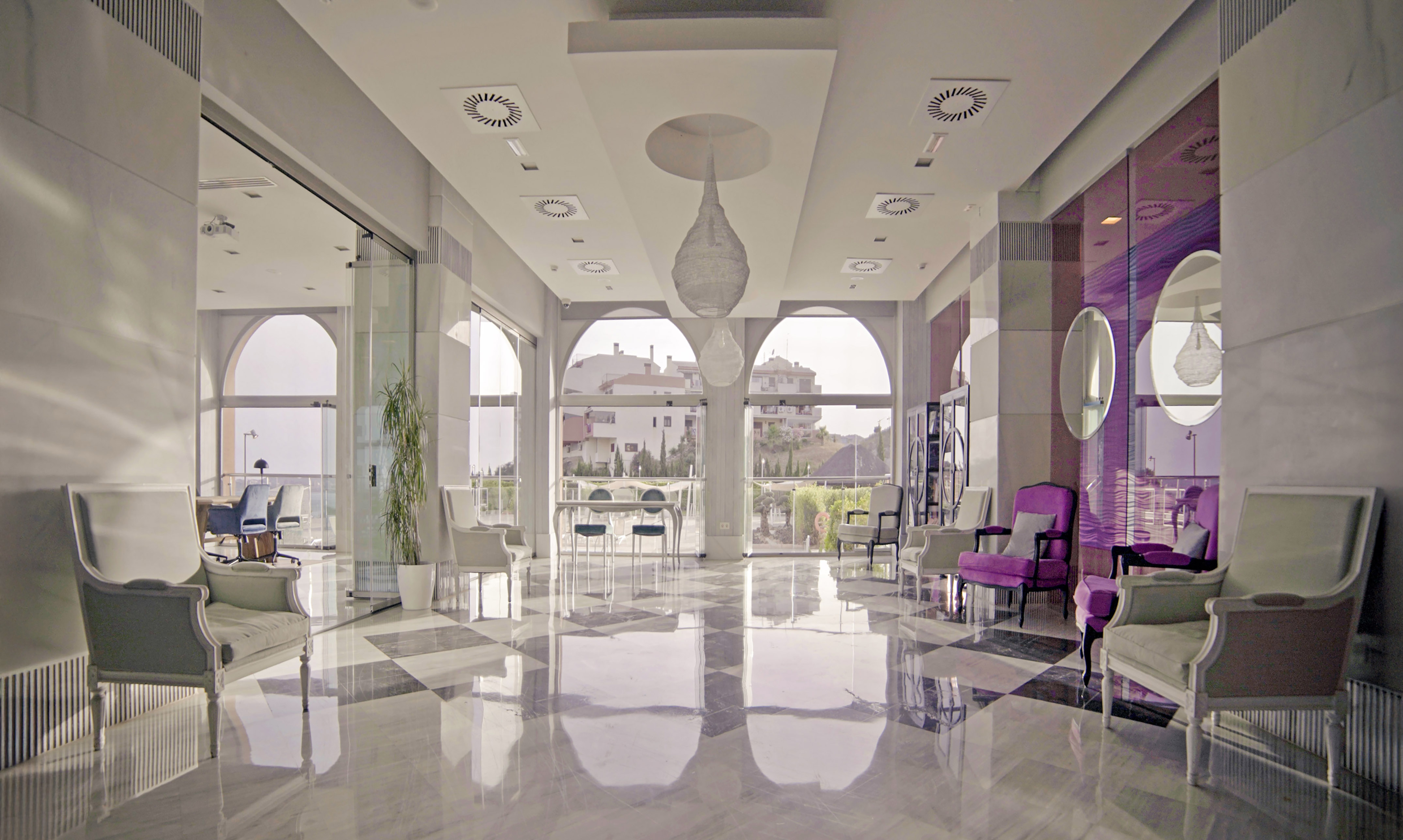 a room with chairs and a large window