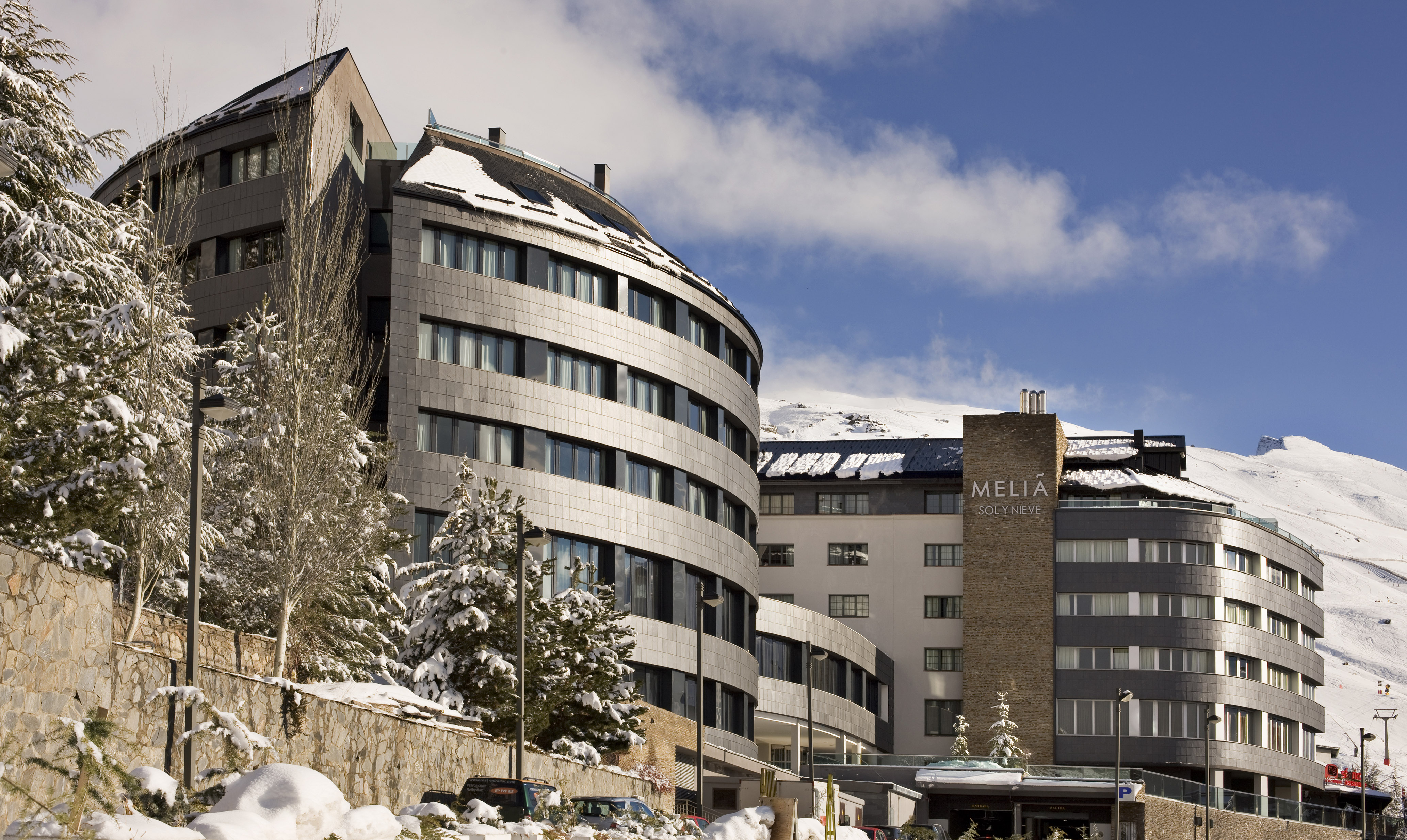 Melia Sol y Nieve hotel, snow-covered modern ski resort building.