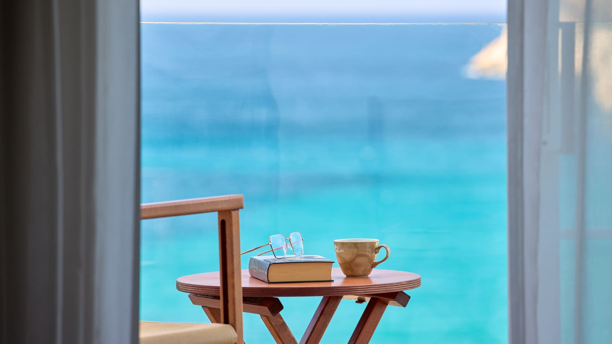 a table with a book and a cup on it