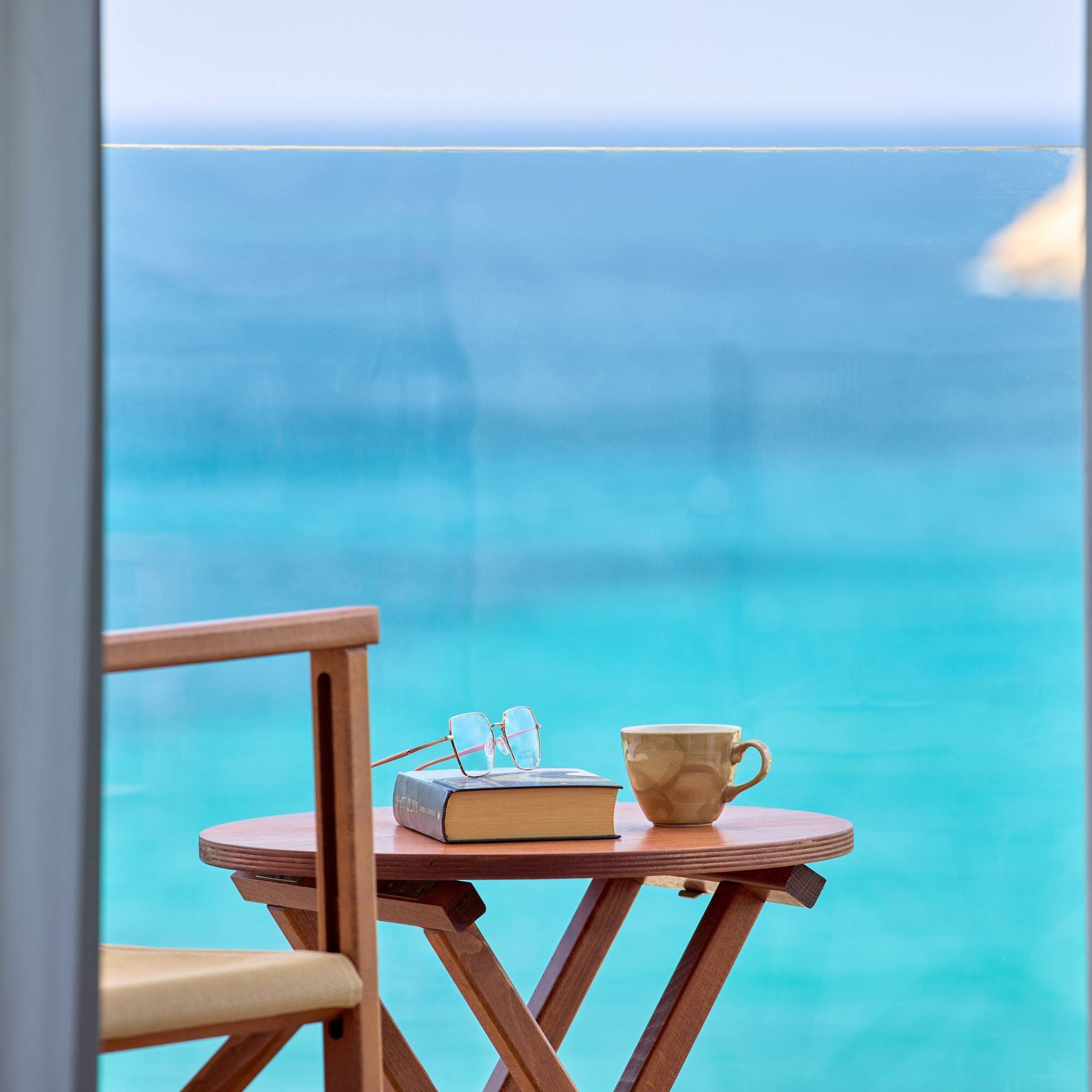 a table with a book and a cup on it