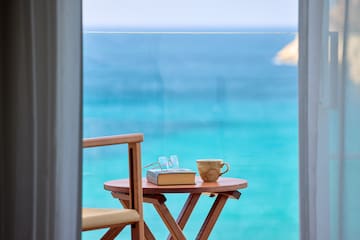 a table with a book and a cup on it