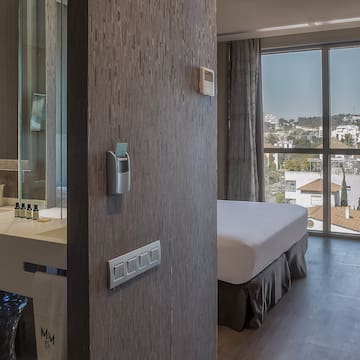 a room with a bed and a glass door