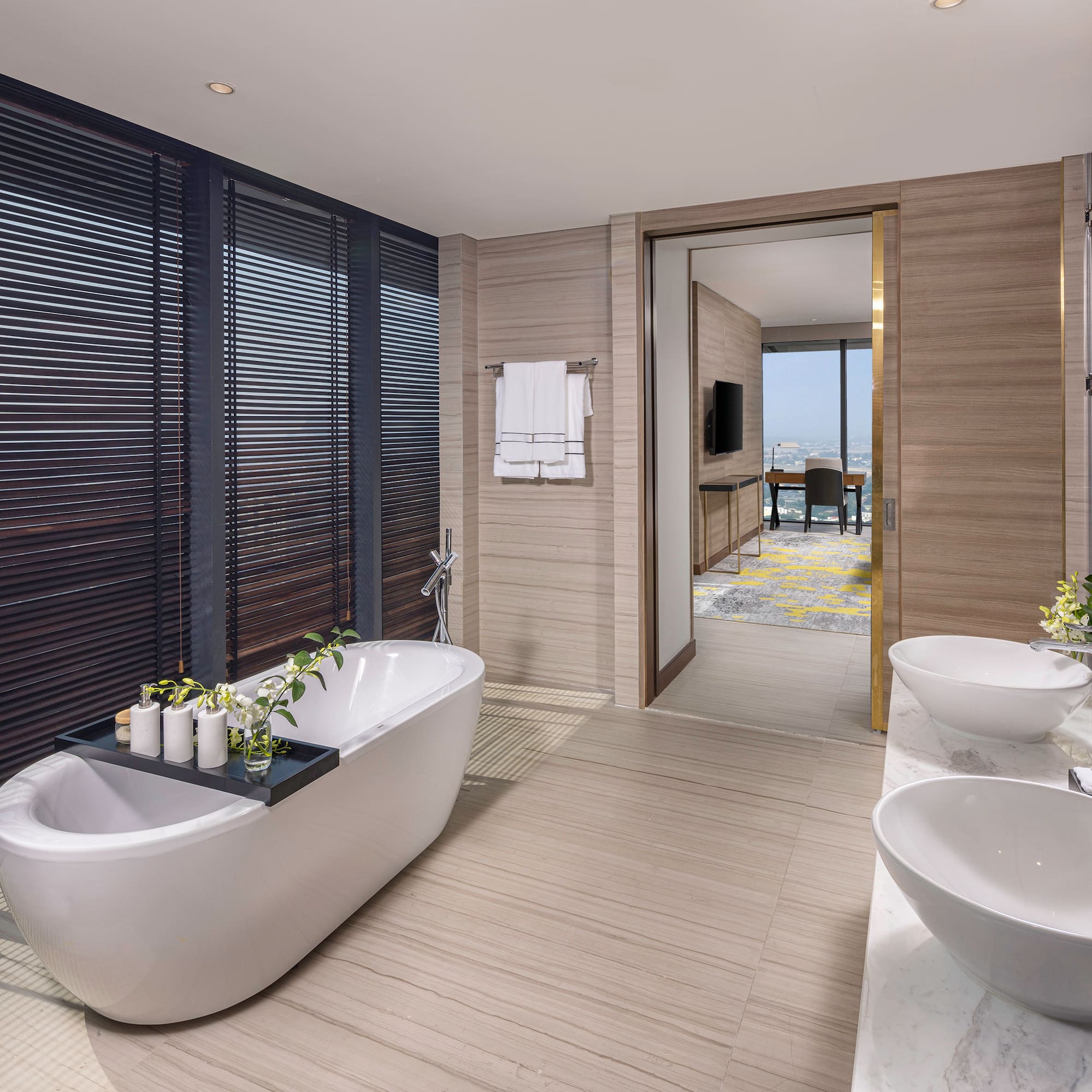 a bathroom with a tub and sinks