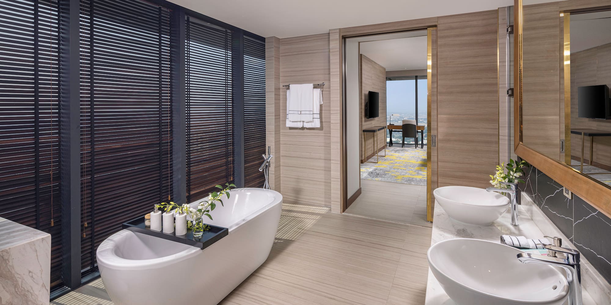 a bathroom with a tub and sinks