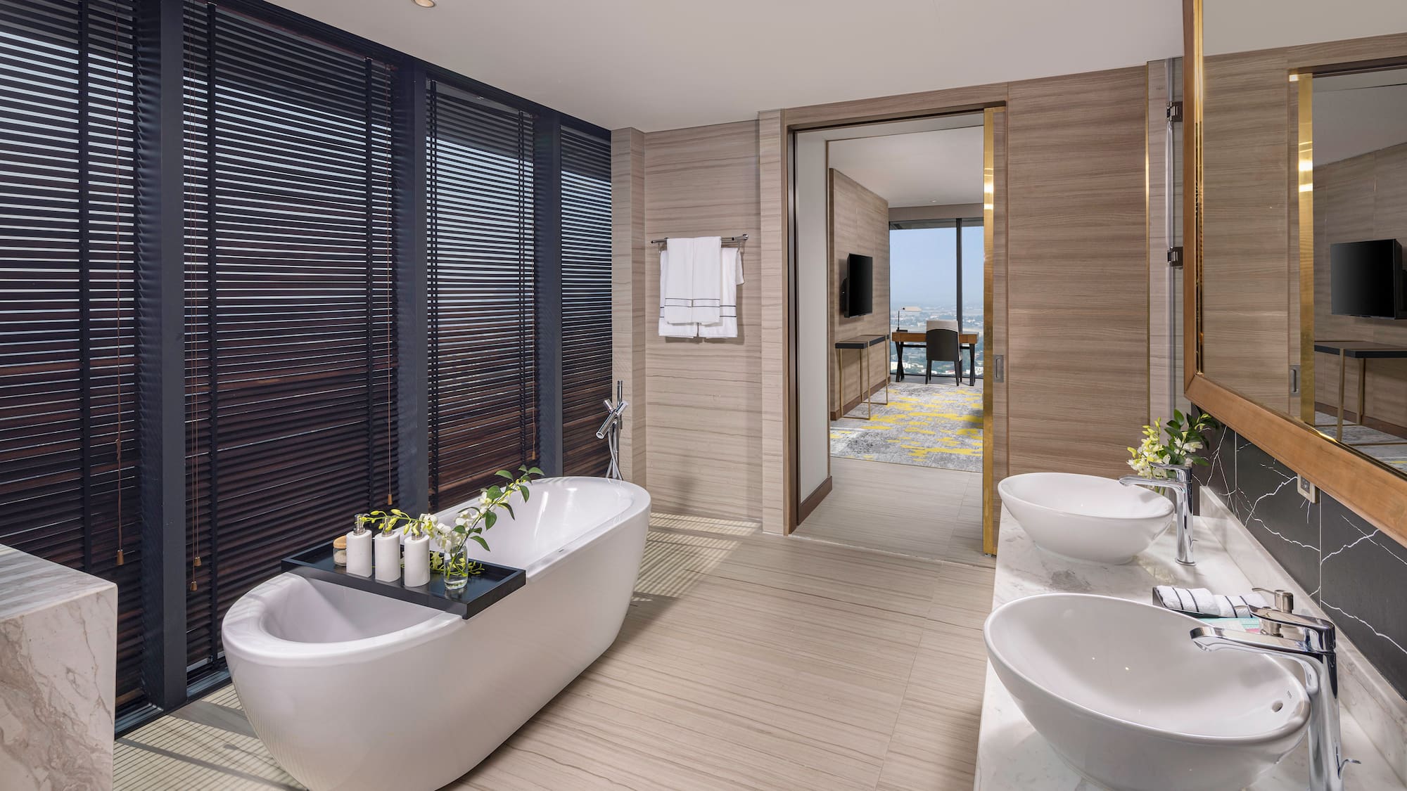 a bathroom with a tub and sinks